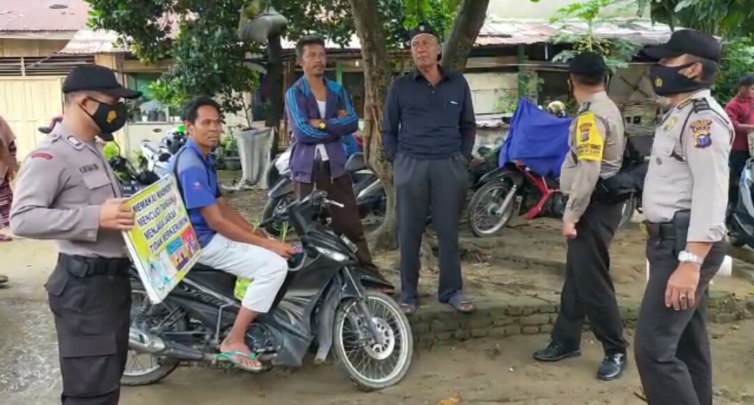 Personil Polsek Bandar Sei Kijang Himbau Warga Terapkan Protokol Kesehatan