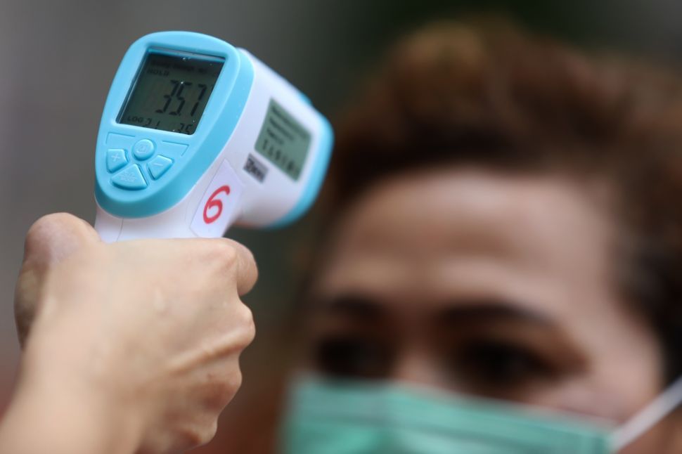 Tidak Ada Lagi Pengukuran Suhu di Tempat Umum, Singapura Longgarkan SOP Covid-19