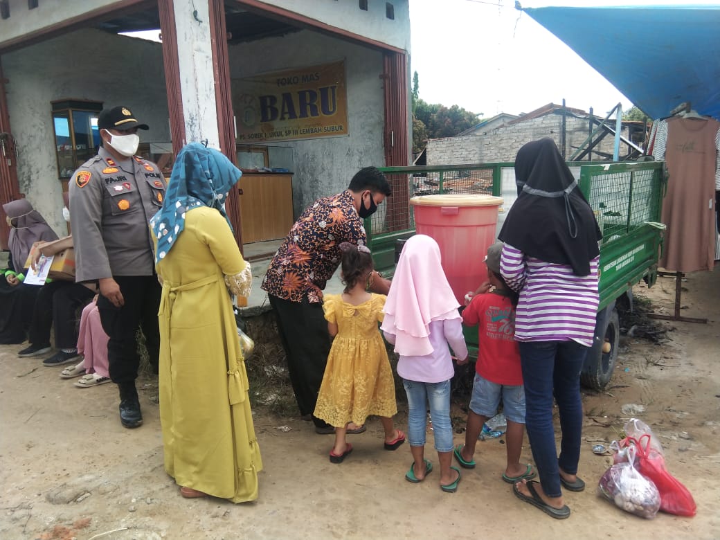 Kapolsek kerumutan Kembali Sosialisasi Protokol Kesehatan di Pasar Bukit Lembah Subur